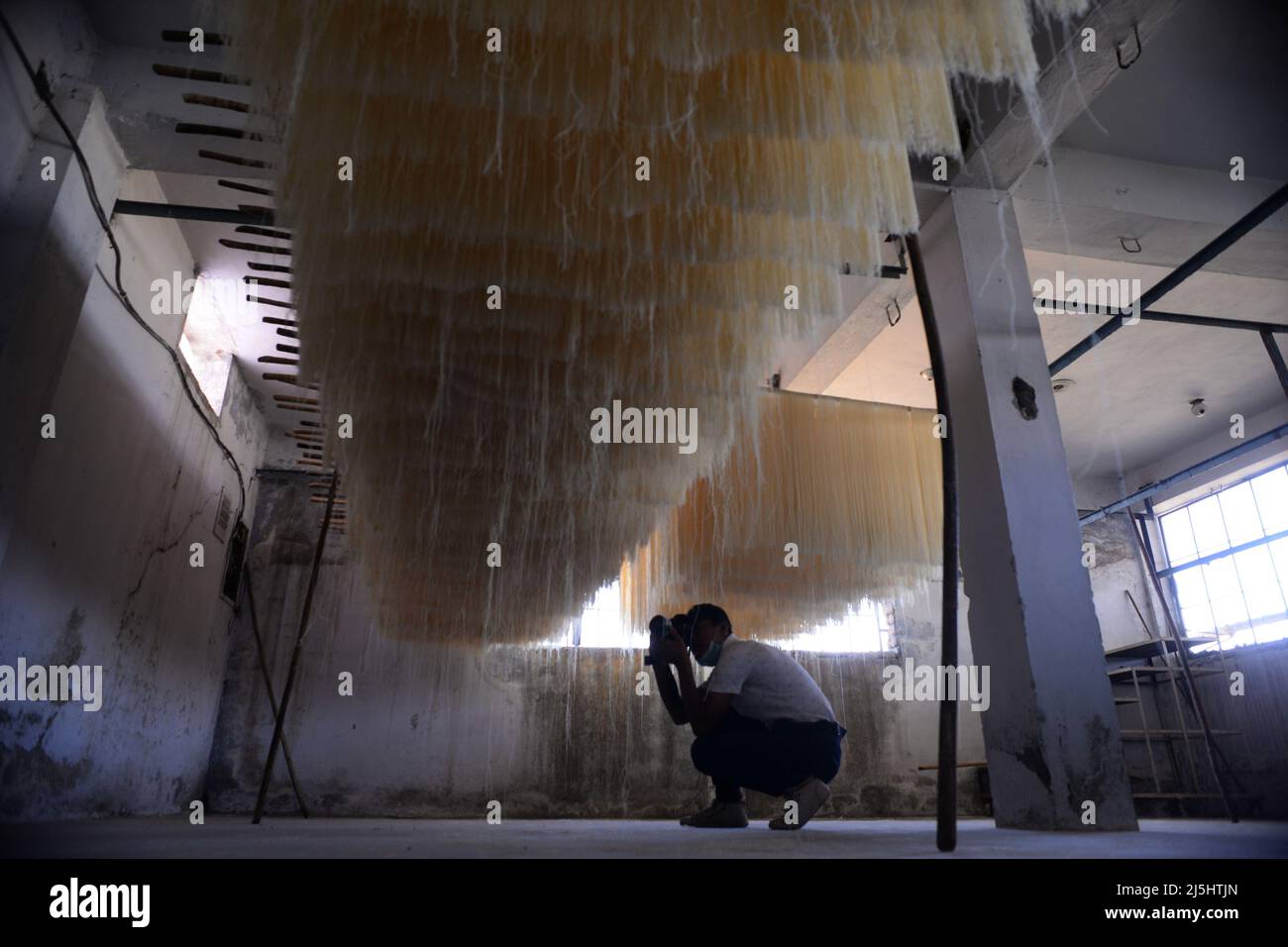 Rawalpindi, Pakistan. 23rd Apr, 2022. Worker arranges rice vermicelli