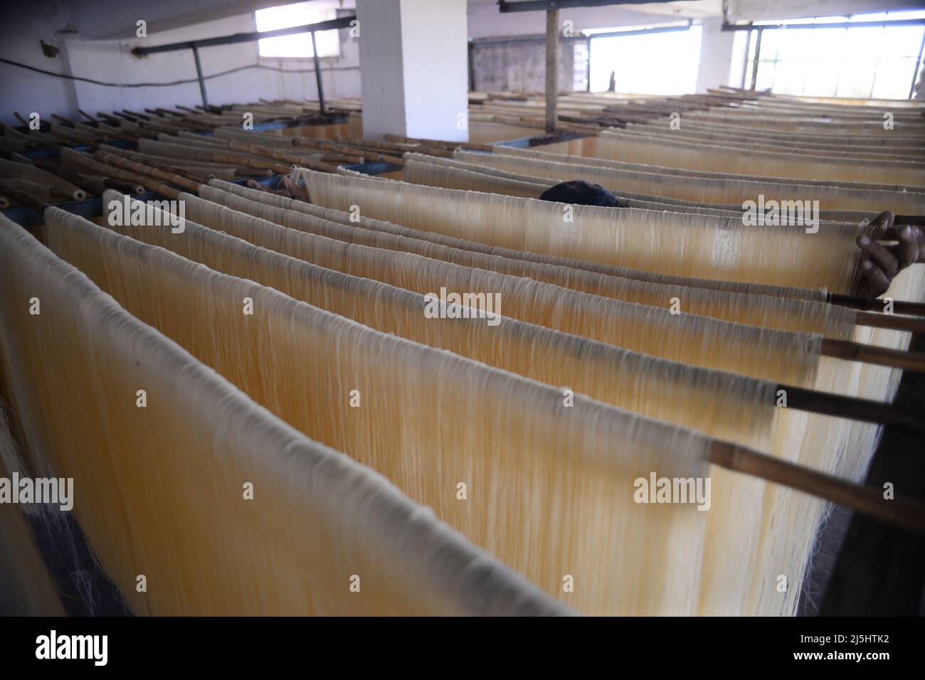 Rawalpindi, Pakistan. 23rd Apr, 2022. Worker arranges rice vermicelli noodles ahead of Eid al