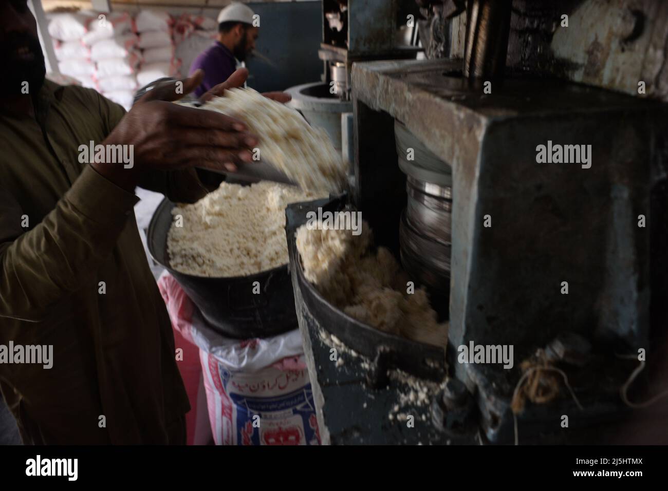 Rawalpindi, Pakistan. 23rd Apr, 2022. Worker arranges rice vermicelli