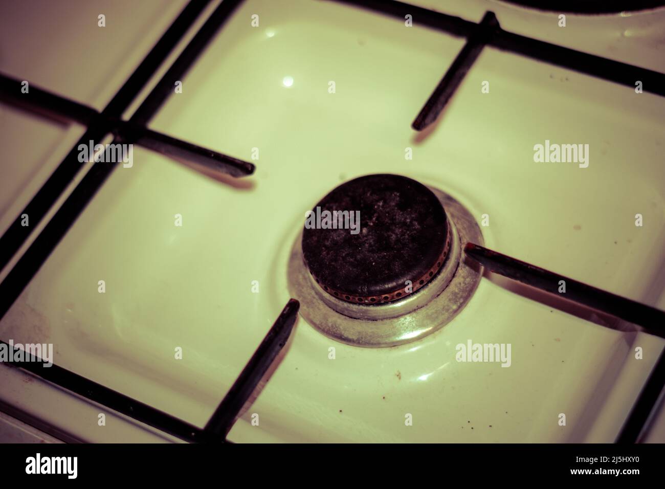 Gas cooker without pans or food, hard times without any food to prepare. Old kitchen. Stock Photo