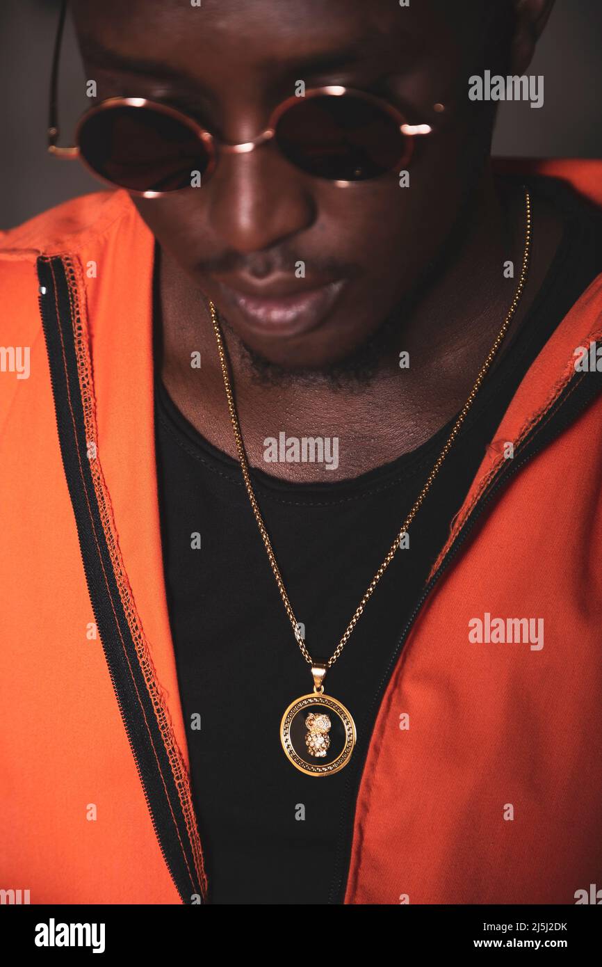 Black prisoner is wearing glasses and a necklace Stock Photo Alamy