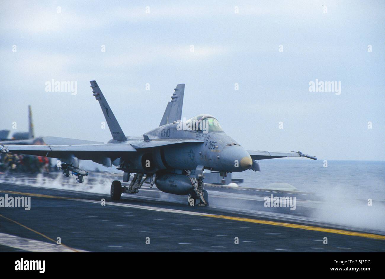 F/A-18 from VFA-113, The Stingers, takes off  aboard aircraft carrier Stock Photo