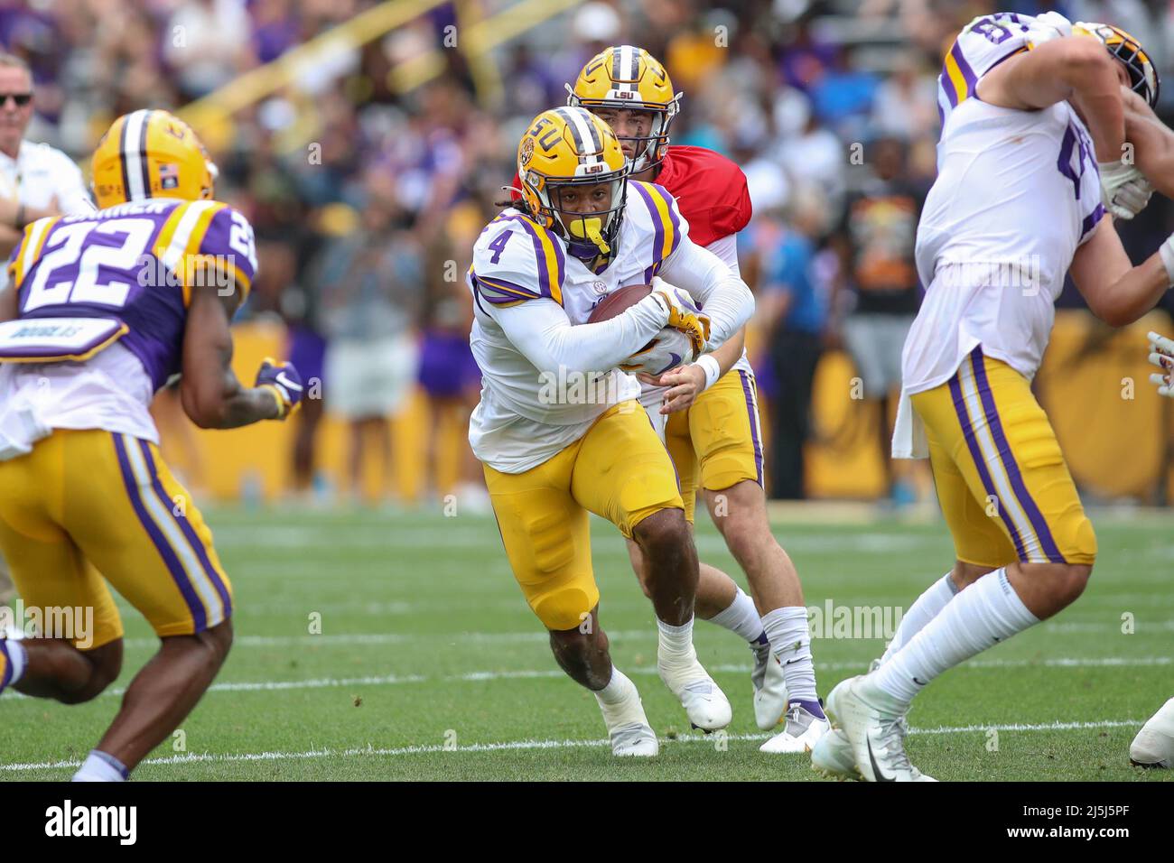 April 23, 2022 LSU running back John Emery Jr. (4) runs through a big