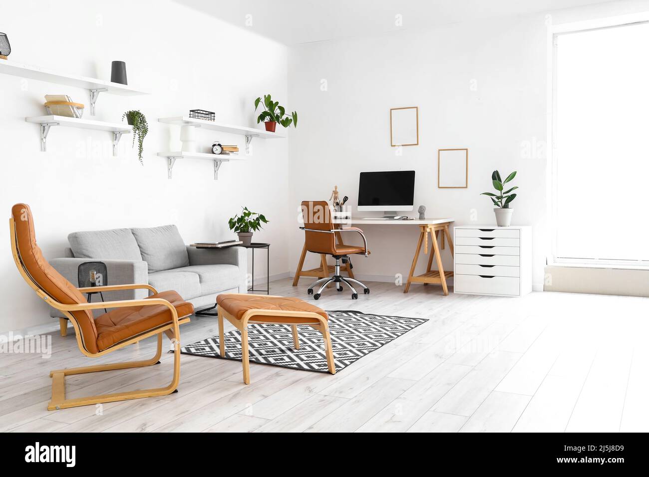 Interior of stylish room with comfortable workplace and modern computer ...