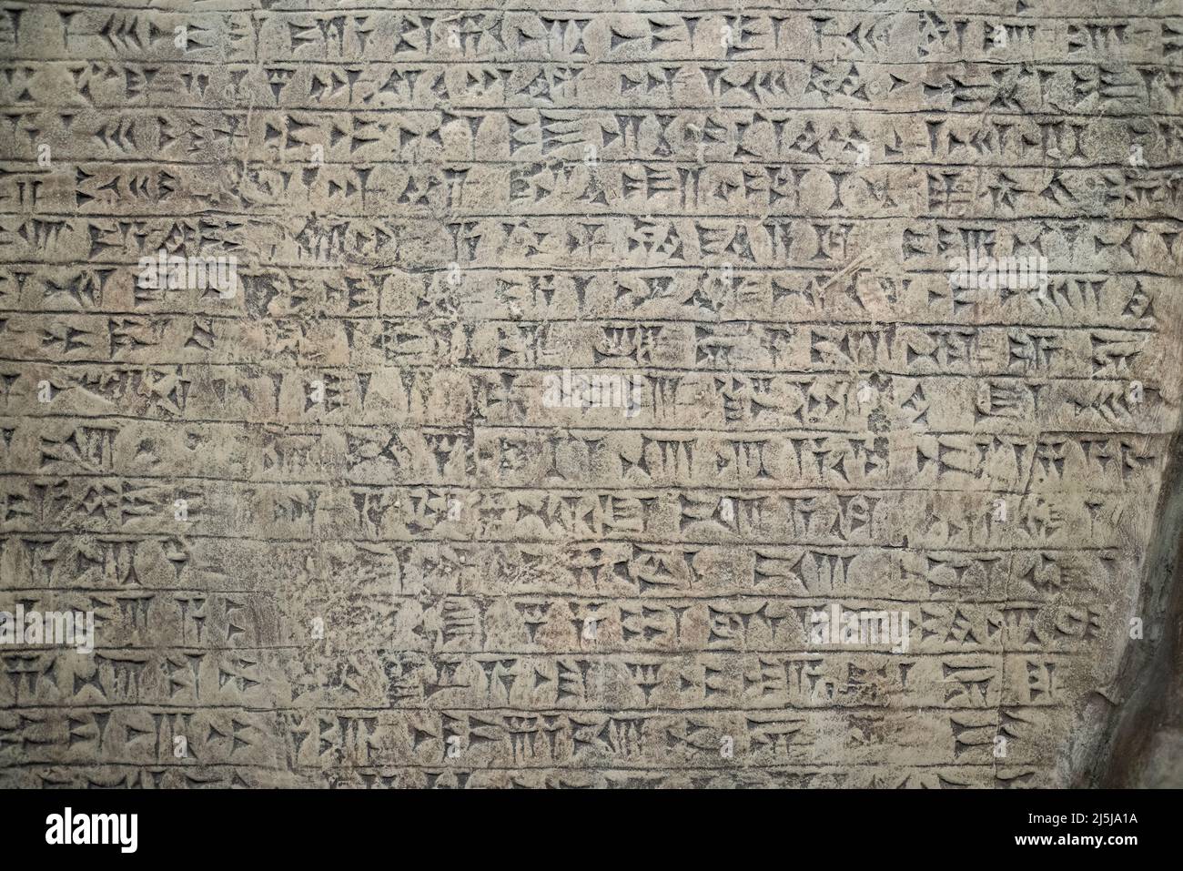 Ancient cuneiform writing script on the wall. High quality photo Stock Photo