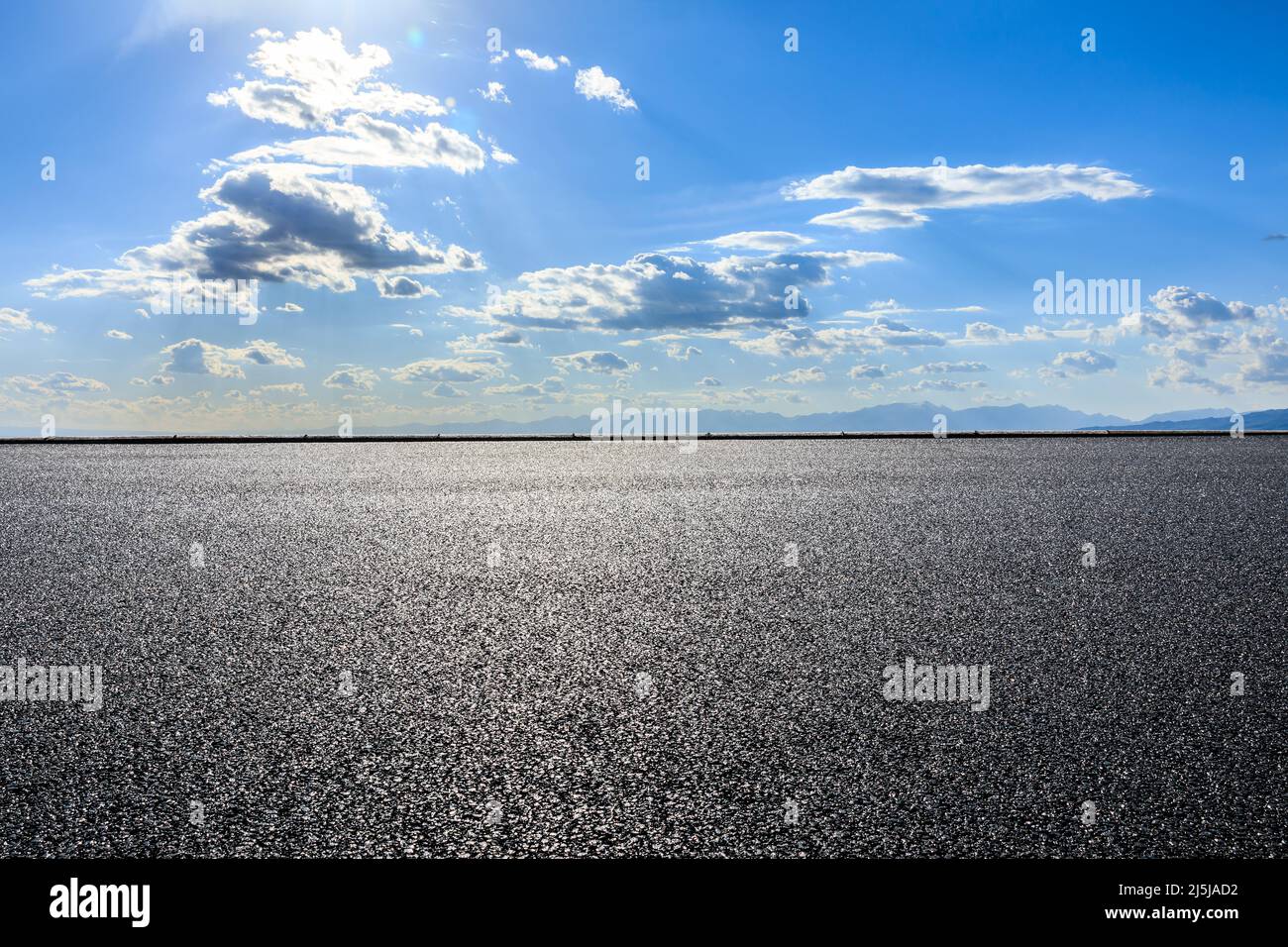 Asphalt road and mountain with sky cloud background Stock Photo - Alamy