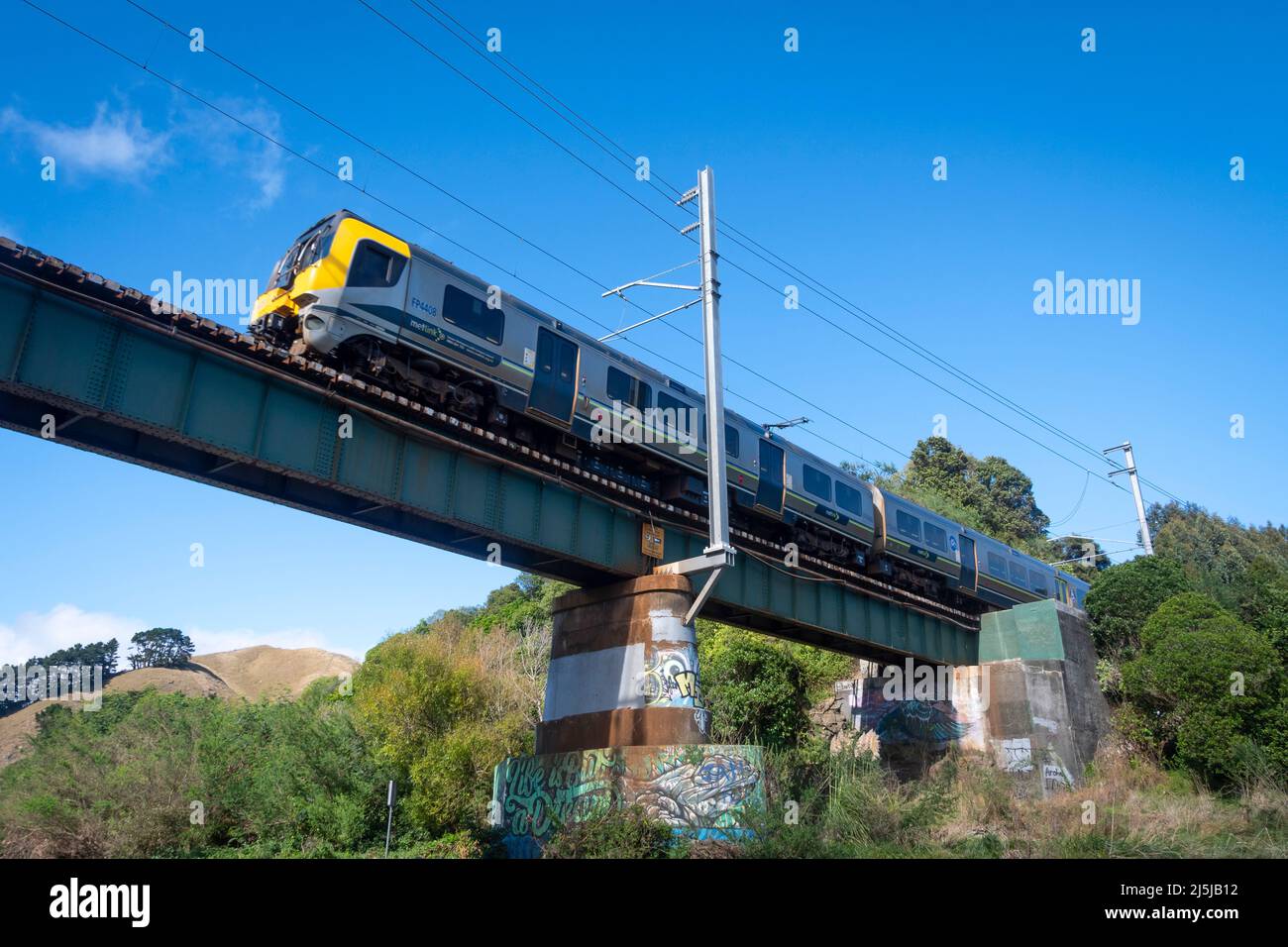 Suburban train crossing bridge over Waikanae River, Kapiti District