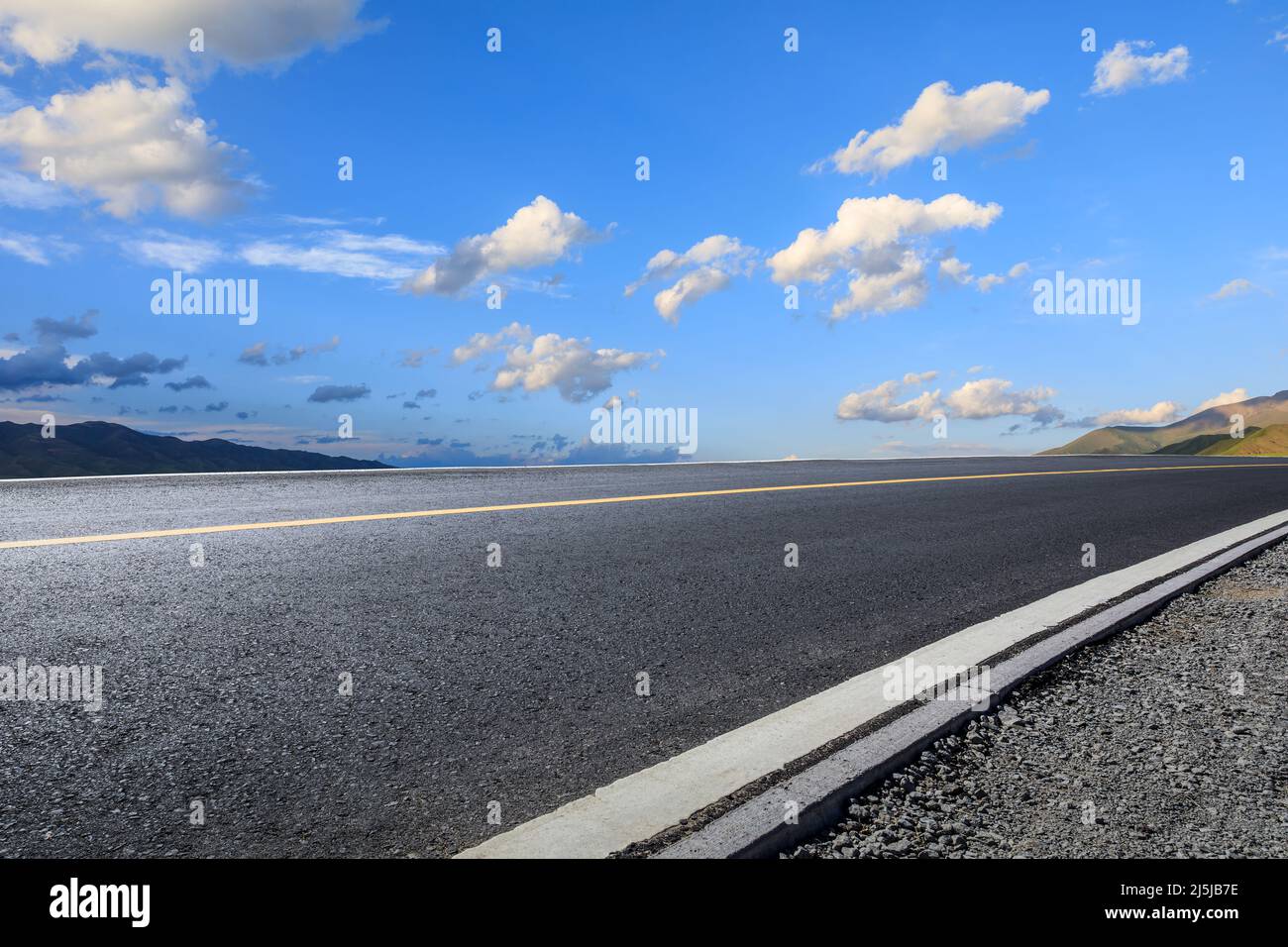 Asphalt road and mountain with sky clouds at sunset Stock Photo - Alamy