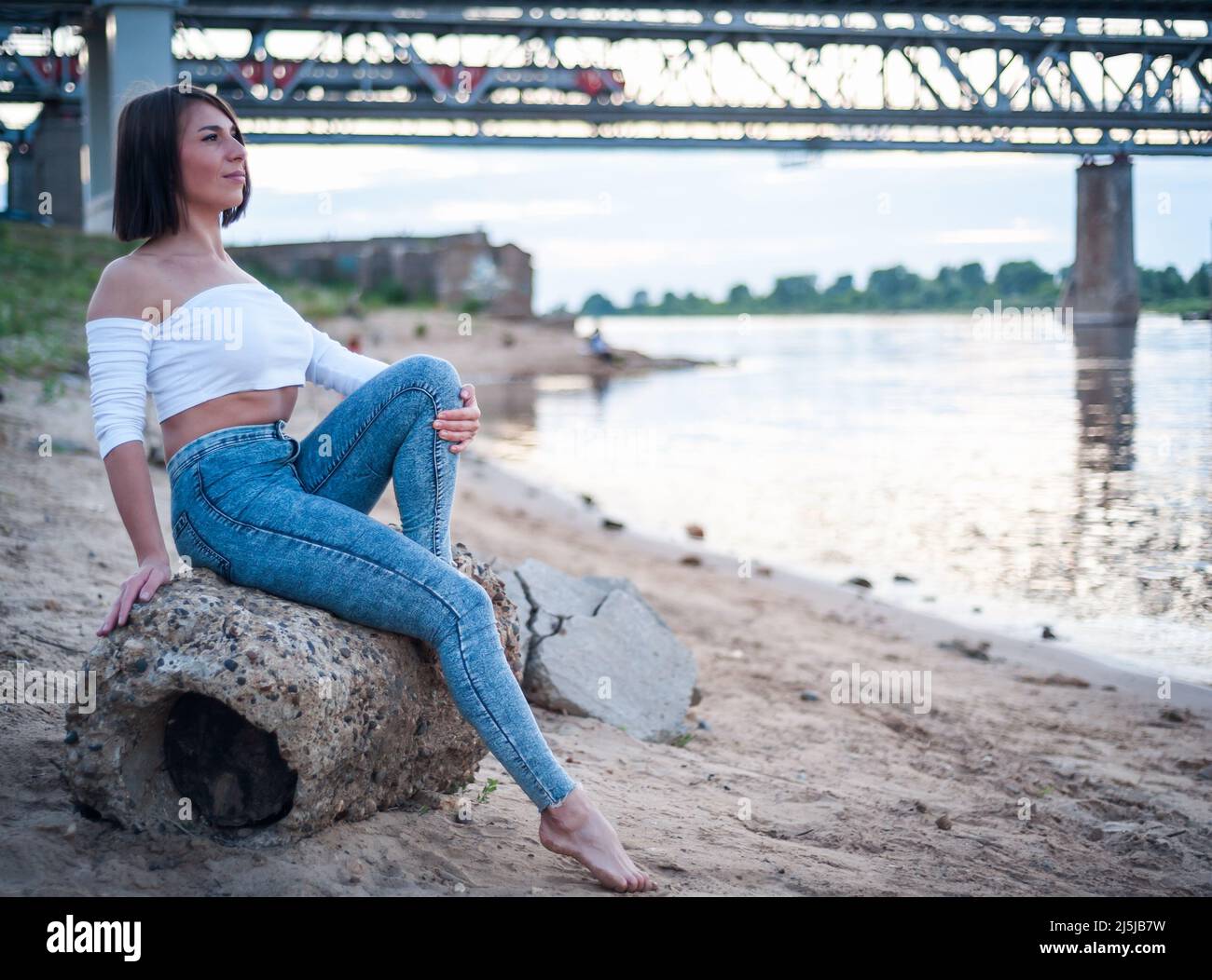 Girl walking on the beach, against the sunset Stock Photo Alamy