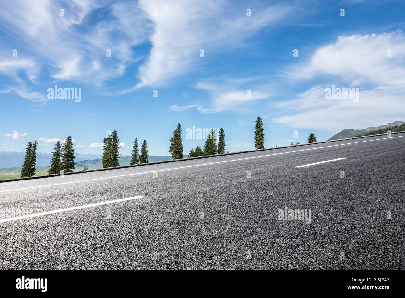 Empty asphalt road and blue sky with white clouds landscape Stock Photo ...