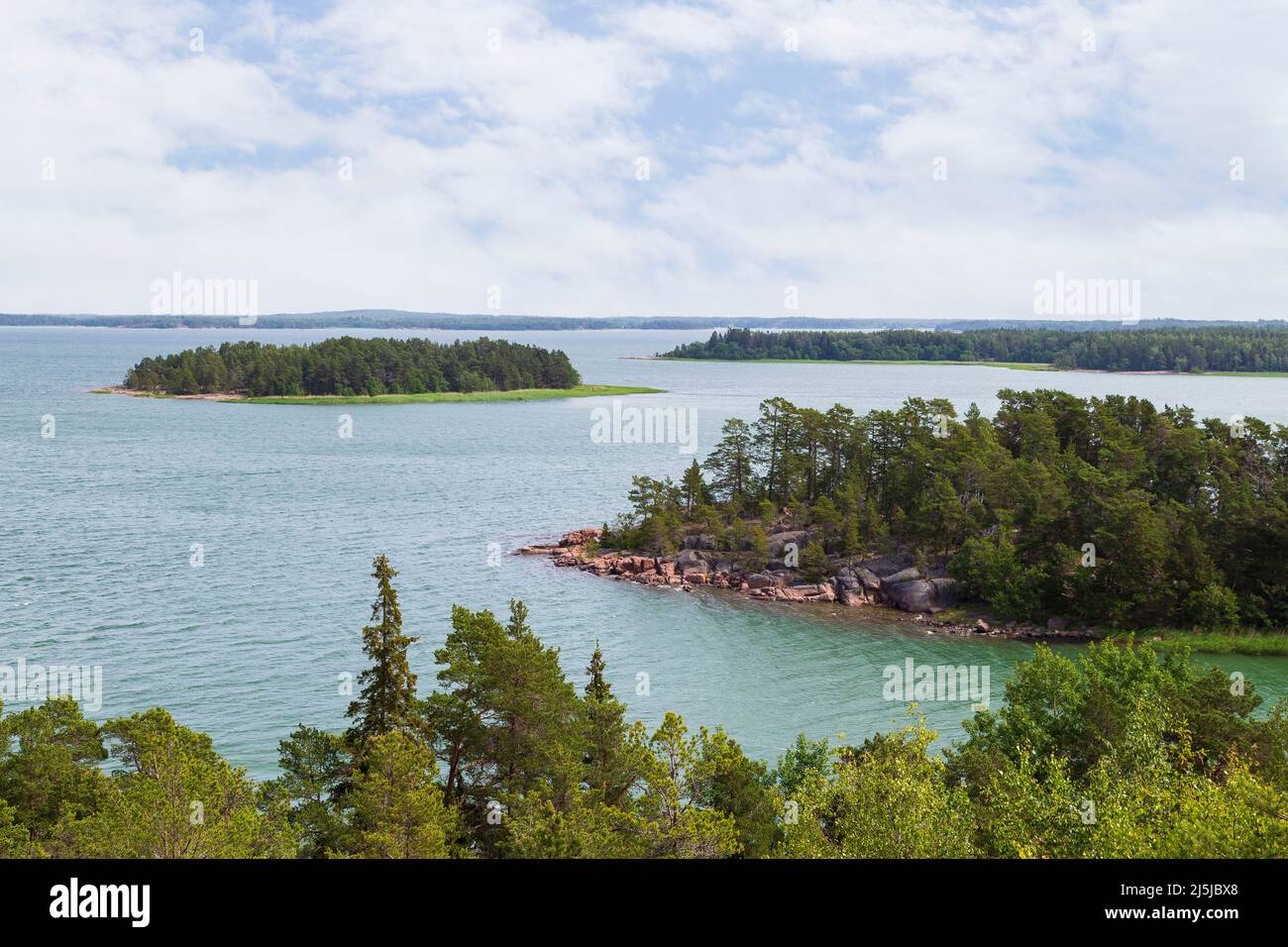 View of small and lush islands, sea and lush shoreline in Åland Islands, Finland, on a sunny day in the summer. Stock Photo