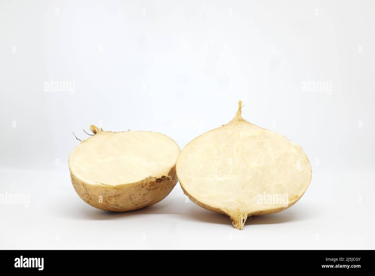 Cut sliced and whole fresh raw jicama, mexican turnip, yam bean