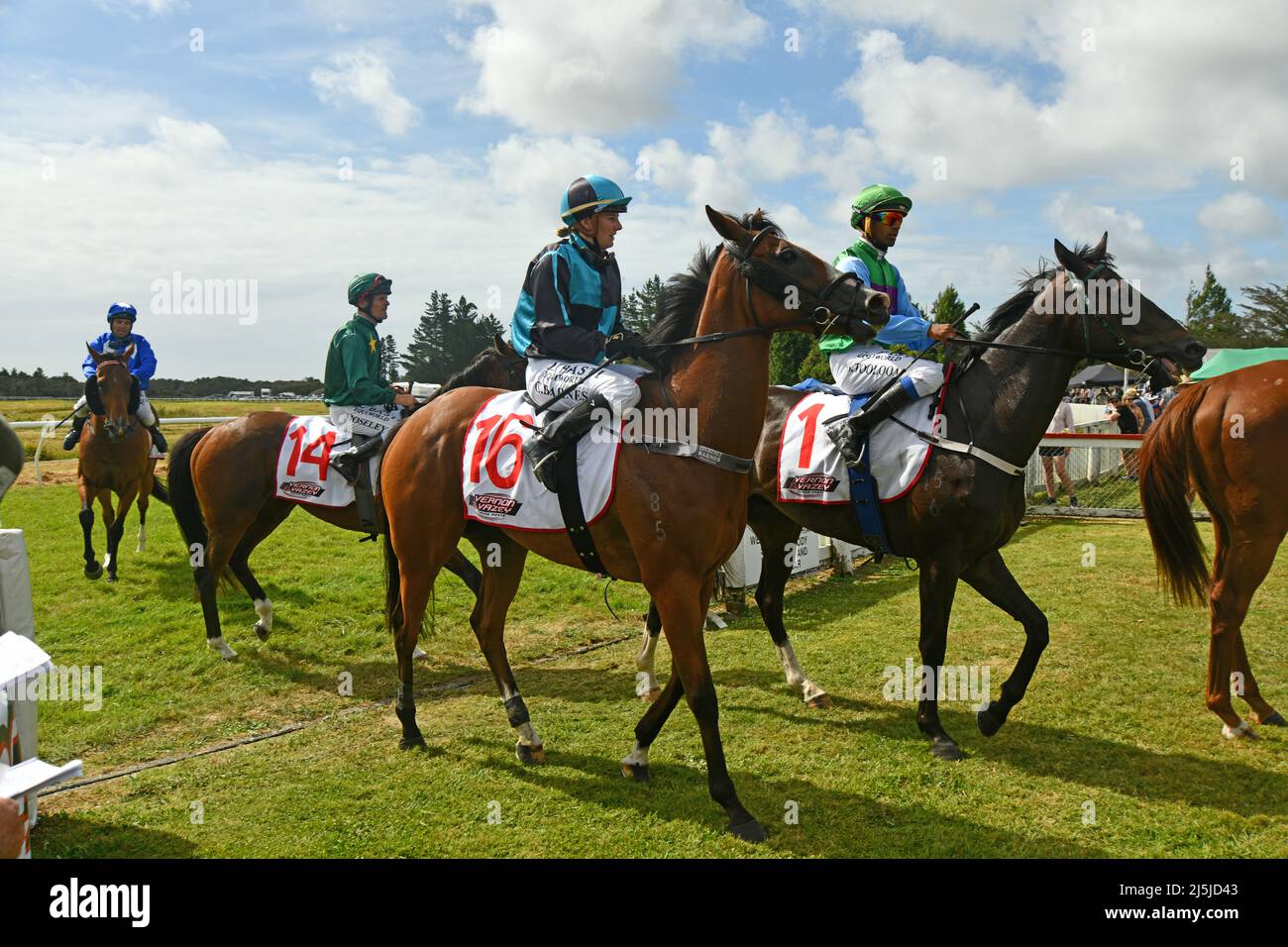 KUMARA, NEW ZEALAND, JANUARY 8, 2022; jockeys ride their mounts back to the winners' circle after a race at the Gold Nuggets competition at the Kumara Stock Photo