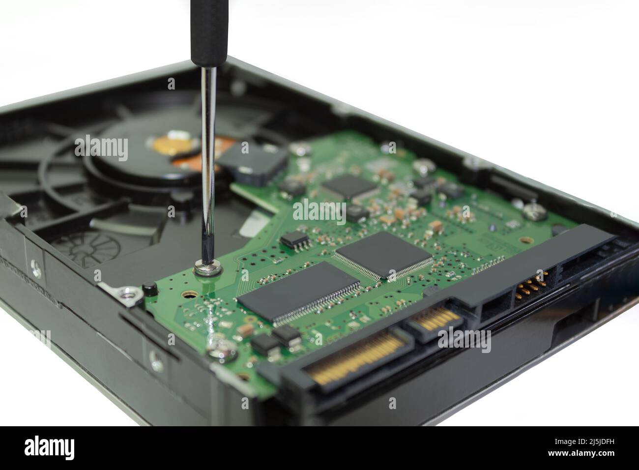 Computer hard drives HDD and a screwdriver on a white background