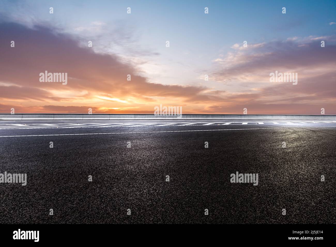 Empty asphalt road and sky clouds at sunrise Stock Photo - Alamy