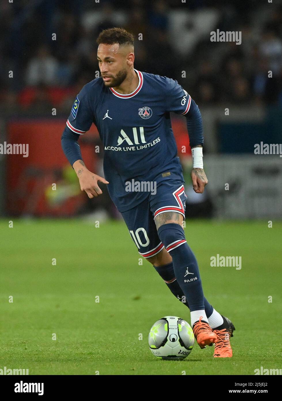 Paris Saint-Germain Neymar during the Ligue 1 Paris Saint-Germain (PSG) v RC Lens football match at Parc des Princes stadium in Paris, France on April 23, 2022. Paris Saint-Germain have won the Ligue 1 title after drawing 1-1 with Lens on Saturday. It looked as if they might have to wait another week to confirm their victory, and were booed off at half-time after a stubborn Lens made life difficult for PSG's star-studded squad. However, the most gilded jewel of all, Lionel Messi, opened the scoring in the 68th minute to secure his first trophy since joining the club from Barcelona last summer. Stock Photo