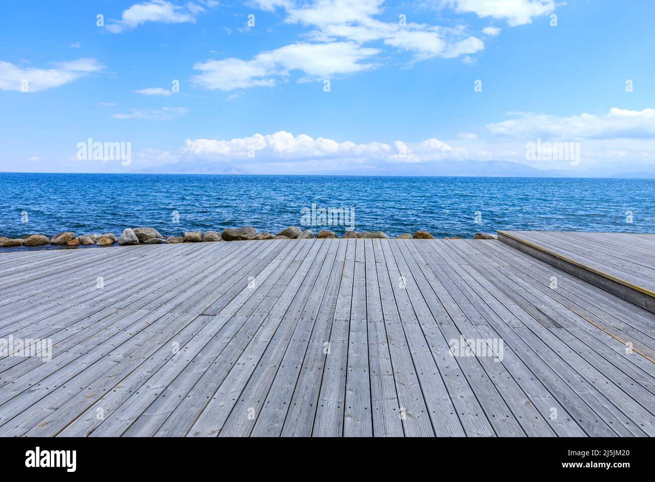 Plank square floor and lake with sky cloud landscape Stock Photo