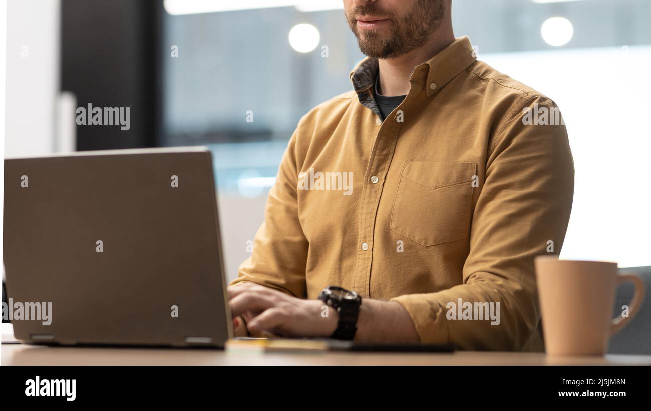 Unrecognizable Businessman Using Laptop Computer Typing Working In Office Stock Photo