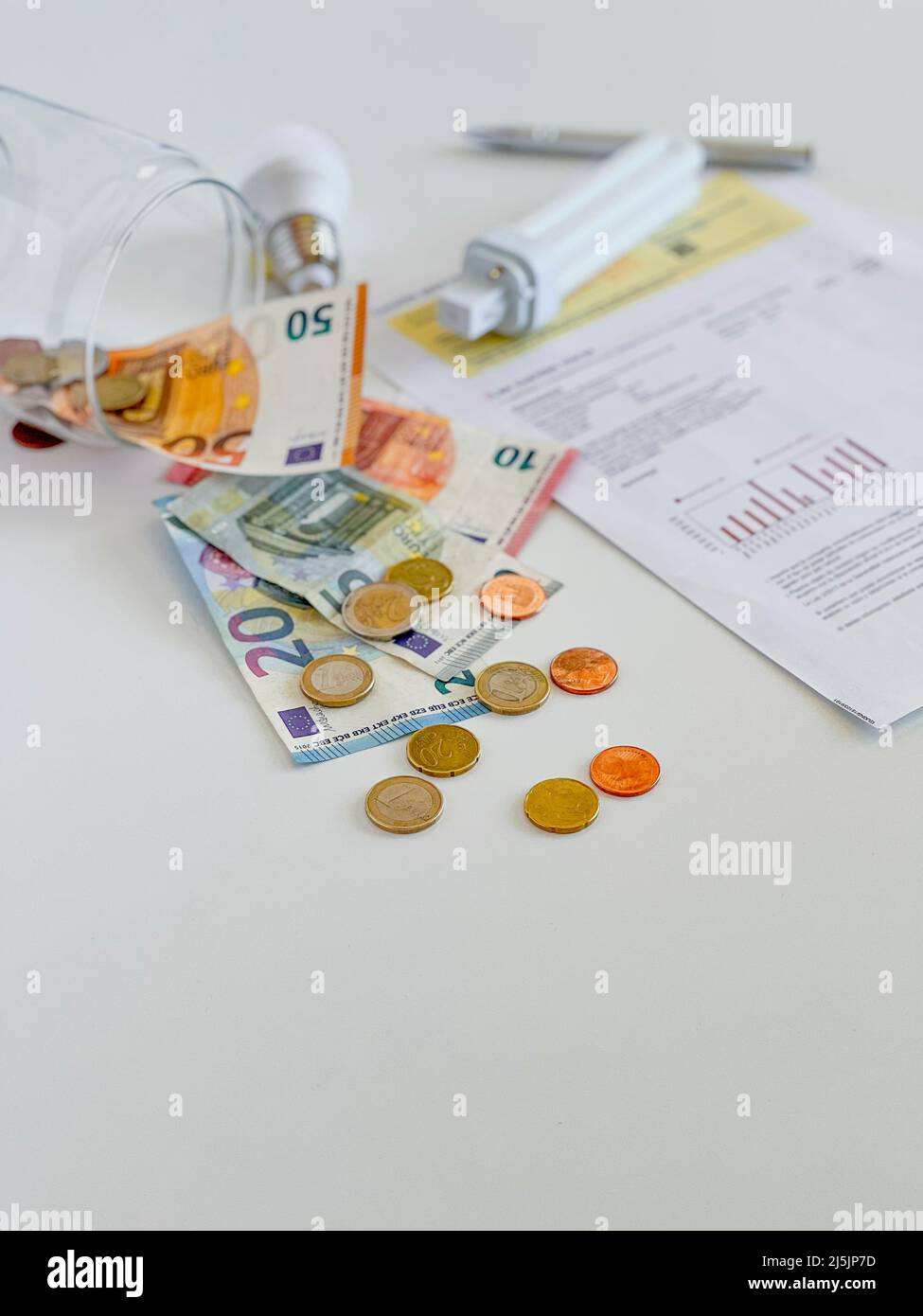 Detail of electricity bill with light bulb, energy theme Stock Photo