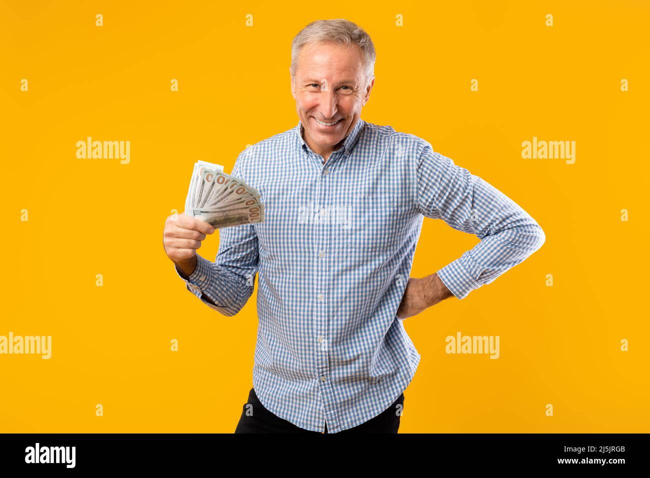 Excited elderly man holding hi-res stock photography and images - Alamy