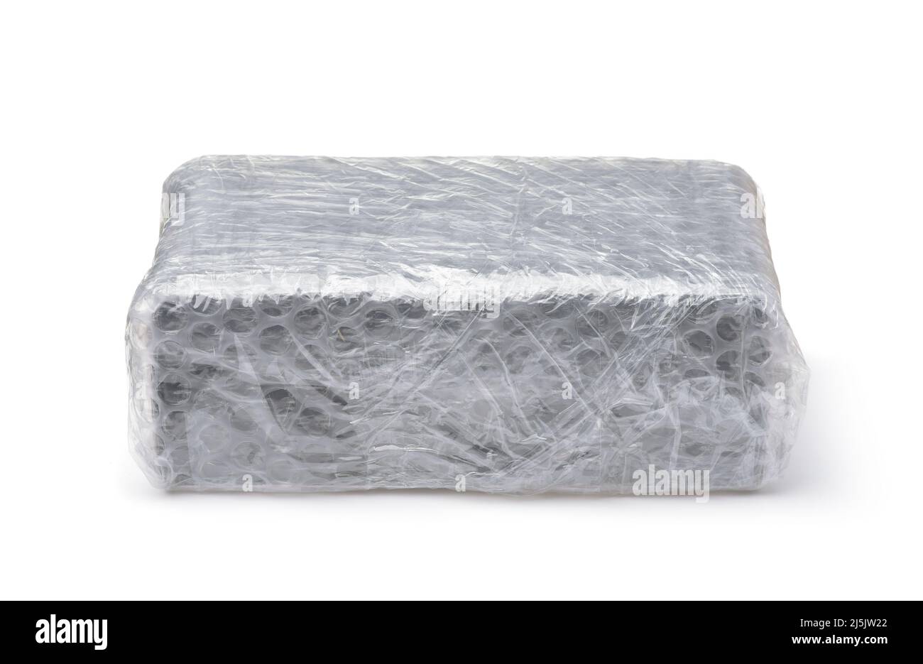 Front view of packaging box wrapped in plastic bubble wrap isolated on white Stock Photo