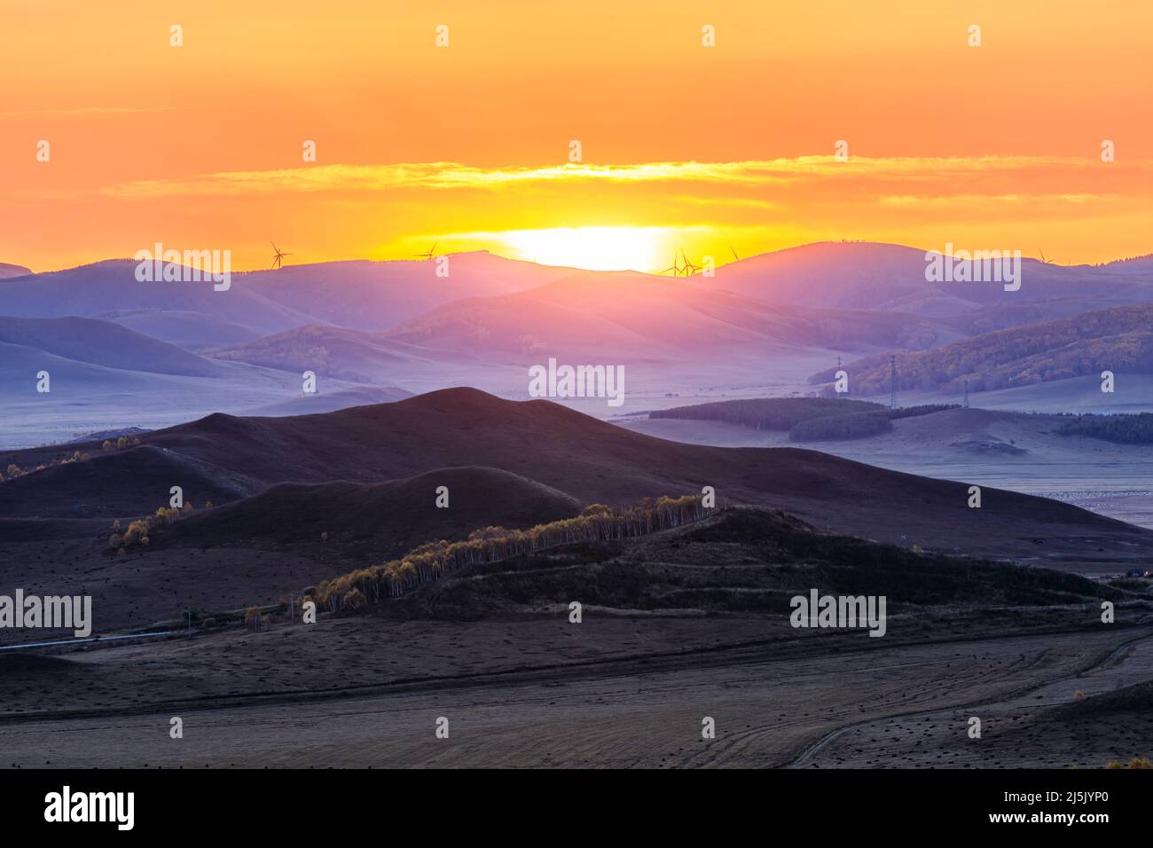 Beautiful natural landscape in Ulan Butong grassland, Inner Mongolia, China. Colorful grassland and mountain scenery in autumn season. Stock Photo