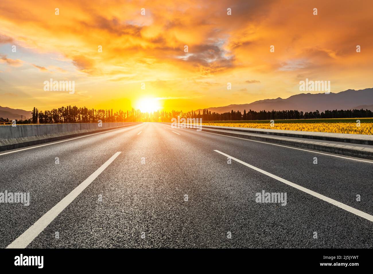 Empty asphalt road and colorful sky clouds at sunrise Stock Photo - Alamy