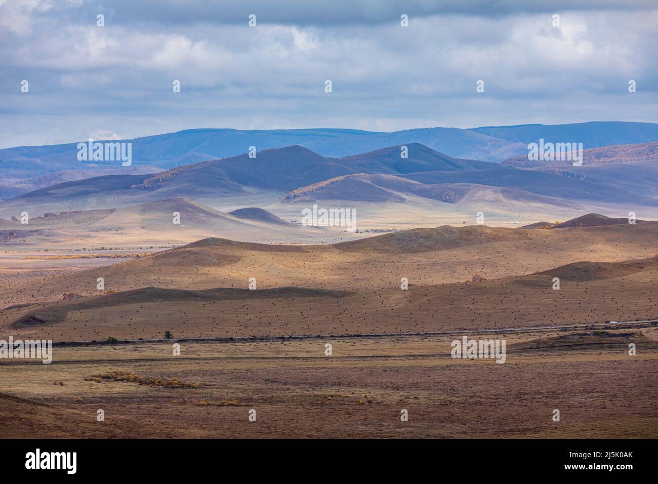Beautiful natural landscape in Ulan Butong grassland, Inner Mongolia, China. Colorful grassland and mountain scenery in autumn season. Stock Photo
