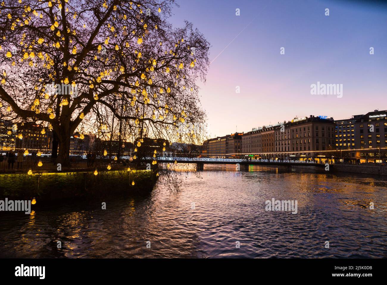 Geneve. Switzerland - December 30, 2021: Sunset over Geneva. Embankment of leman River Stock Photo