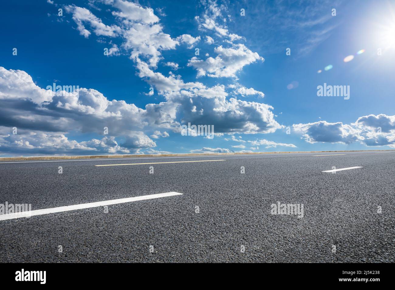 Asphalt road and sky cloud under blue sky. Road and sky background Stock  Photo - Alamy