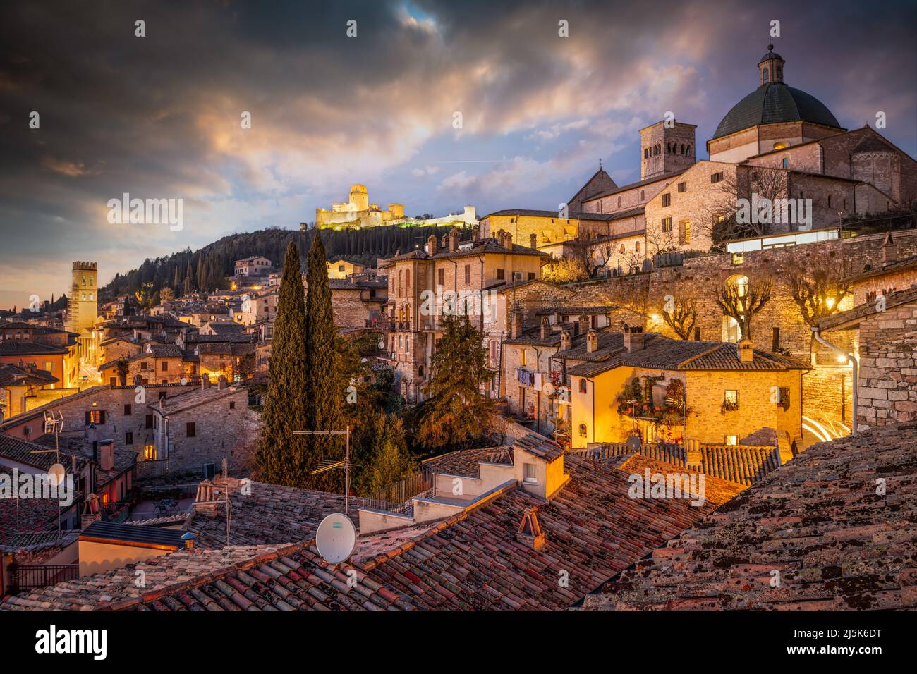 Assisi, Italy rooftop hilltop old town skyline at dusk. Stock Photo