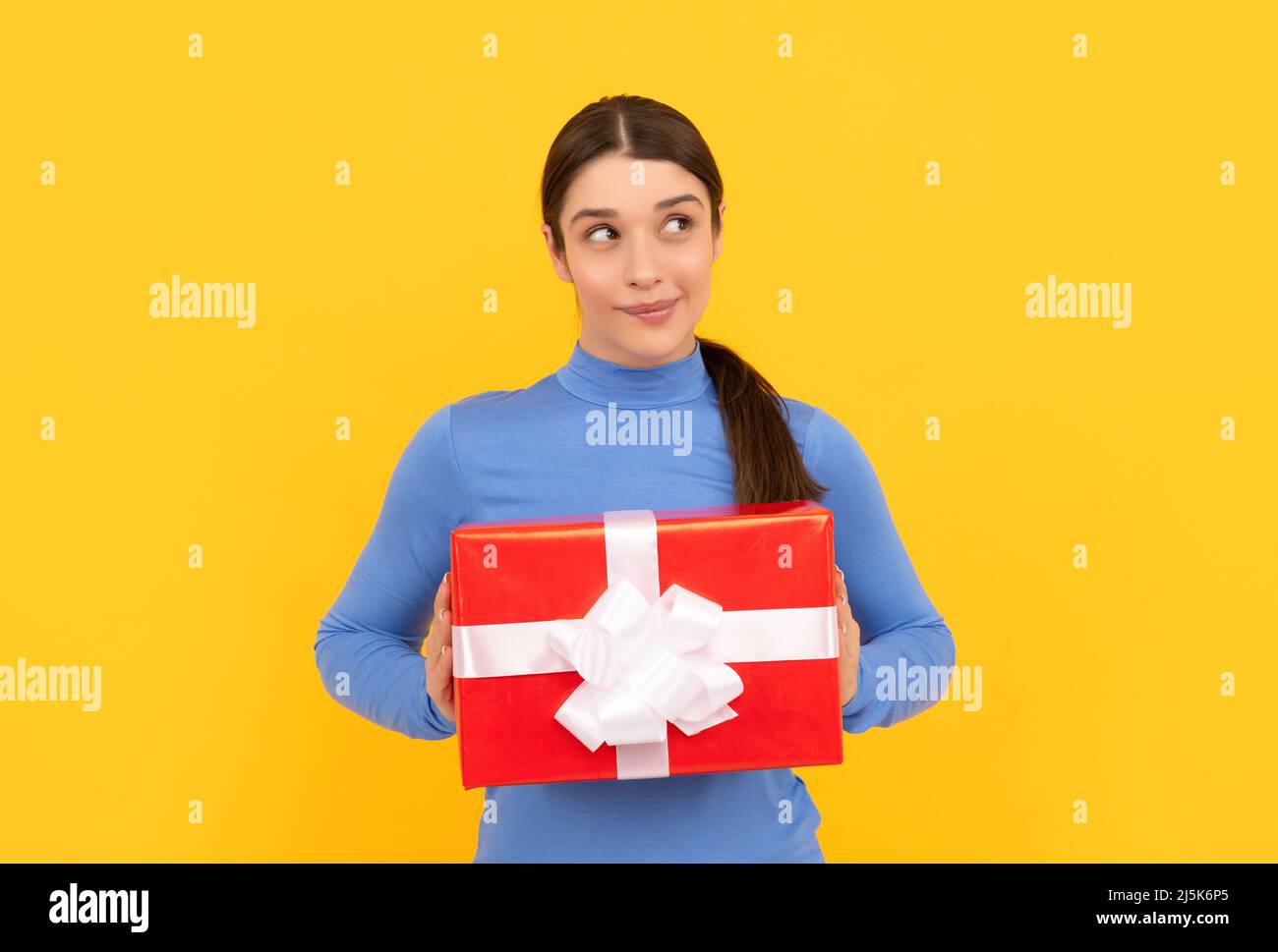black friday discount. seasonal sales. dreamy girl with box on yellow background. boxing day. Stock Photo