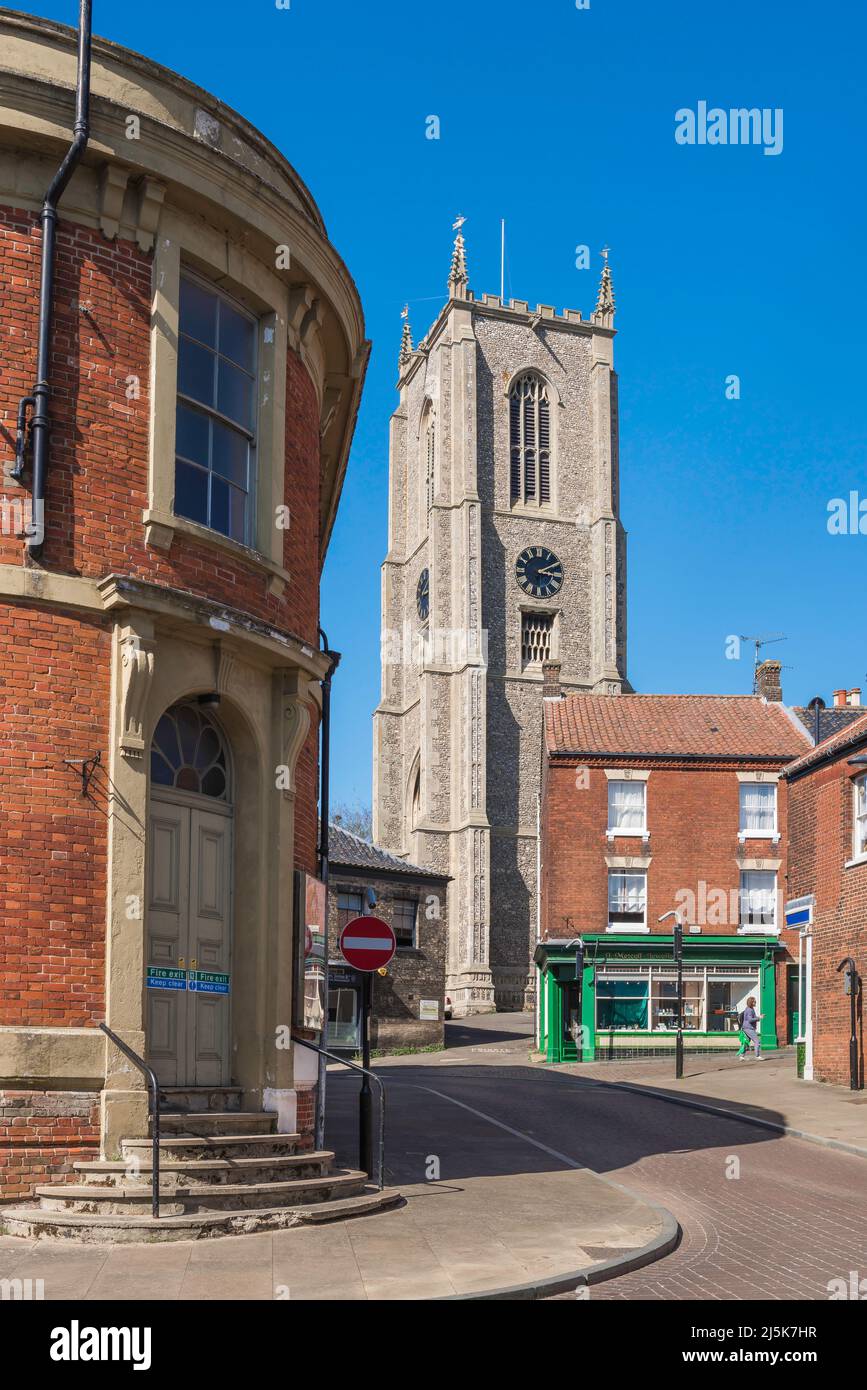 Fakenham town, view along Oak Street with the curved facade of the town cinema (left) and the Parish Church visible straight ahead, Fakenham, UK Stock Photo