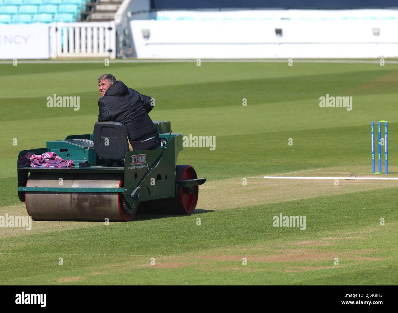 24 April, 2022. London, UK. Grounds staff using the heavy roller between innings as Surrey take on Somerset in the County Championship at the Kia Oval, day four. David Rowe/Alamy Live News Stock Photo