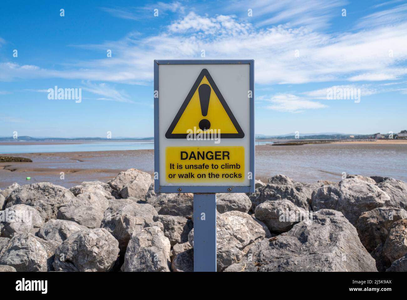 Yellow triangular danger warning sign Stock Photo