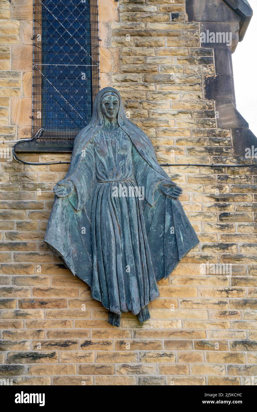 Sculpture of Virgin Mary on exterior wall, St Mary's church, Roman Catholic Parish of Saint John Henry Newman - Morecambe, Lancashire Stock Photo