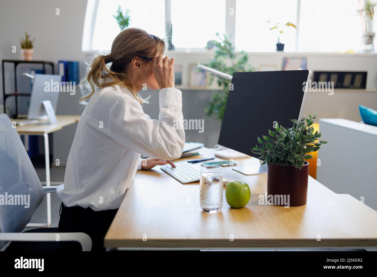 Adult business woman working on computer in the office Stock Photo - Alamy