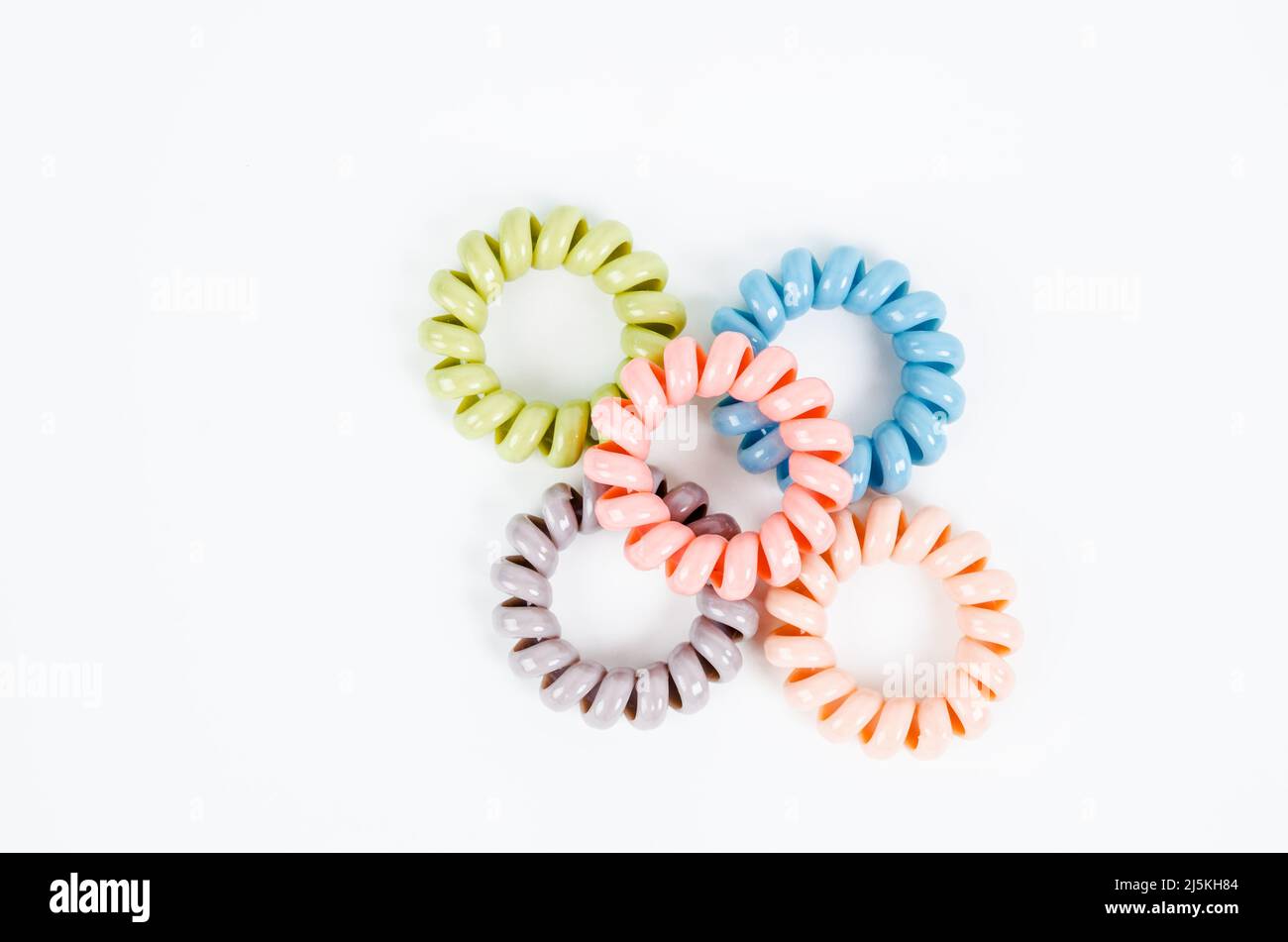 rubber bands for hair tie on white background Stock Photo - Alamy