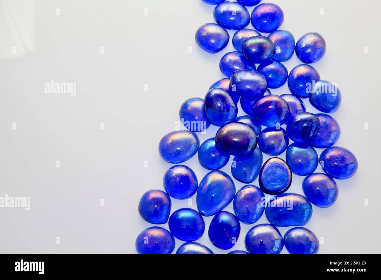 Blue glass bead patterns on white background April 2022 Stock Photo Alamy