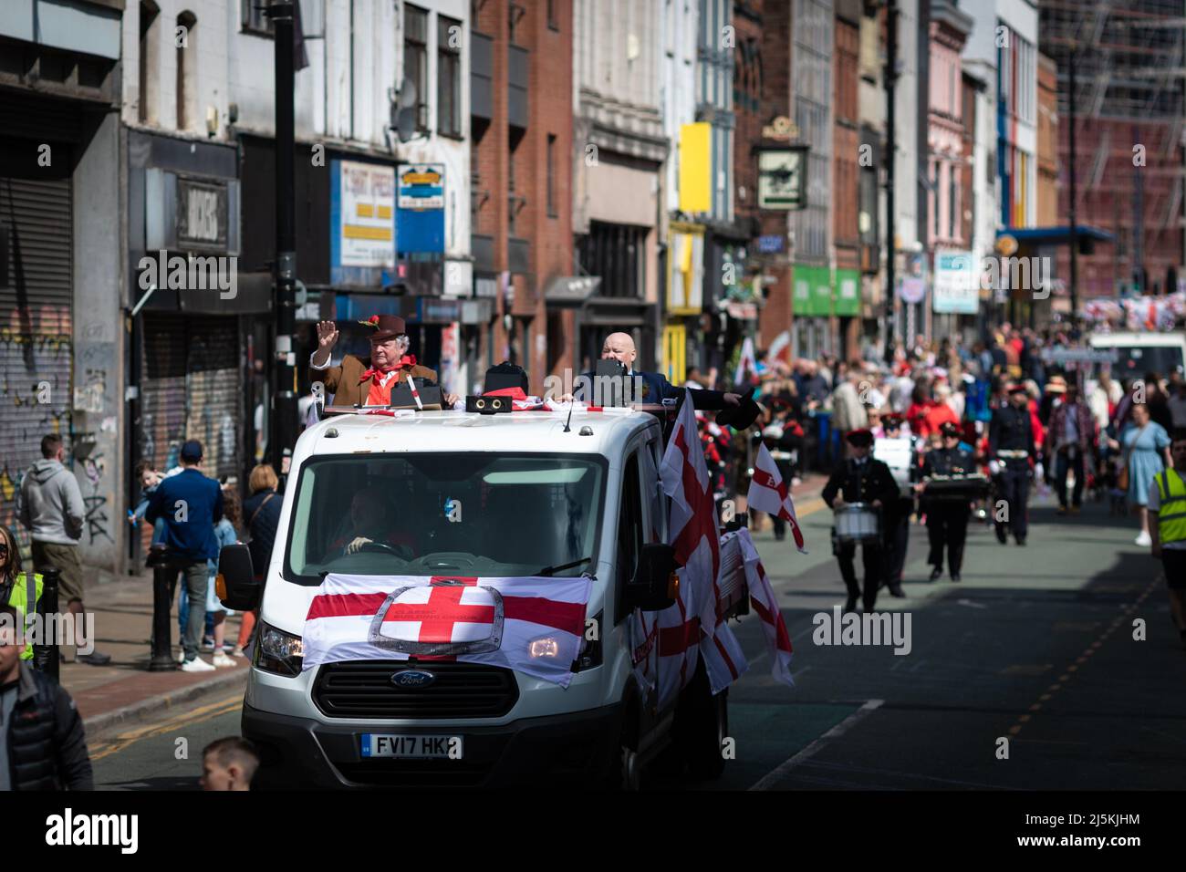Manchester, UK. 24th Apr, 2022. The public line the streets as the annual St Georges Day parade passes through the city. Hundreds of people join in the annual celebration which marks the death of the patron Saint Of England. Credit: Andy Barton/Alamy Live News Stock Photo