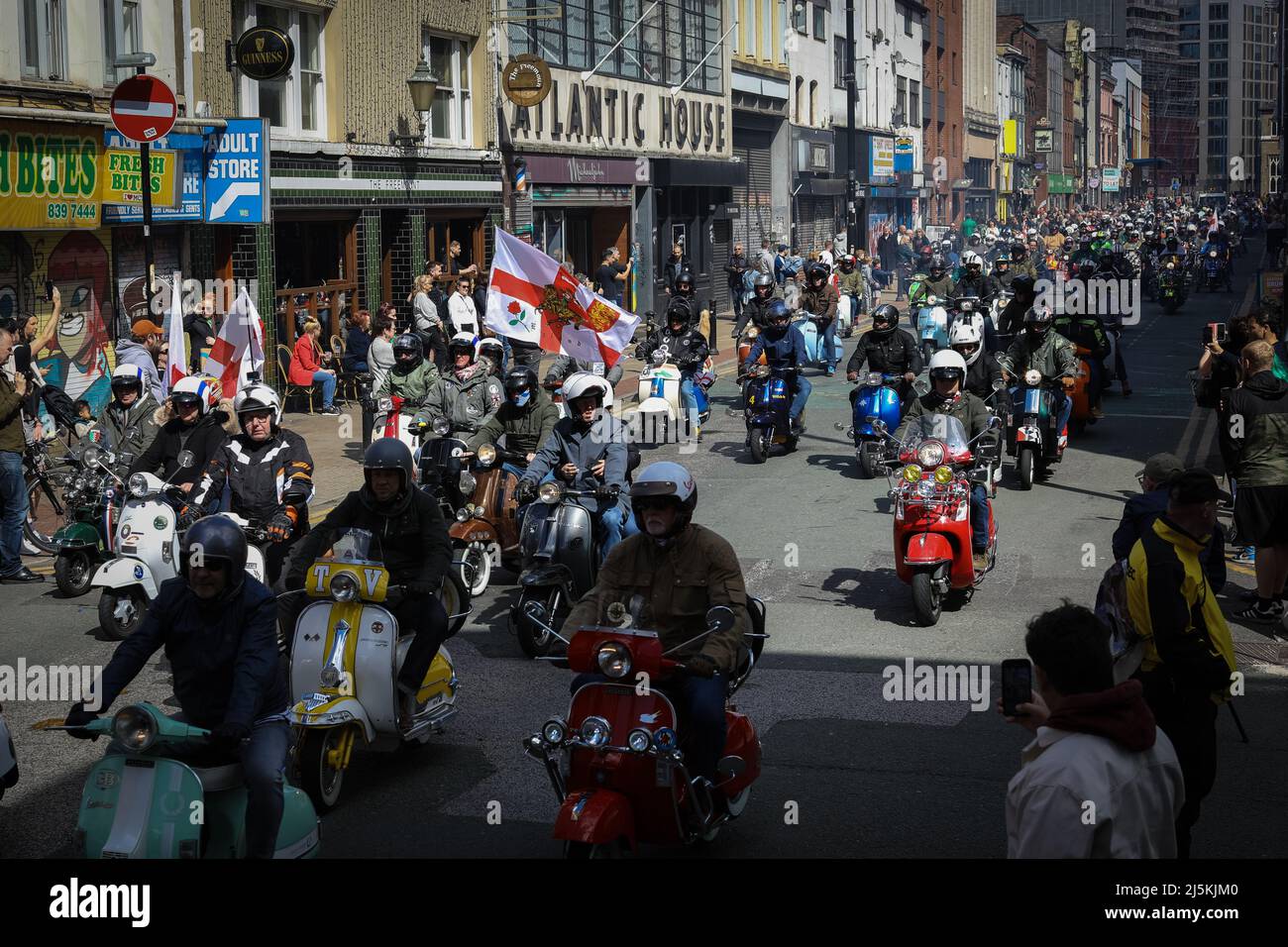 Manchester, UK. 24th Apr, 2022. Hundreds of Mod Scooters join the the annual St Georges Day parade as it passes through the city. Hundreds of people join in the annual celebration which marks the death of the patron Saint Of England.ÊAndy Barton/Alamy Live News Credit: Andy Barton/Alamy Live News Stock Photo