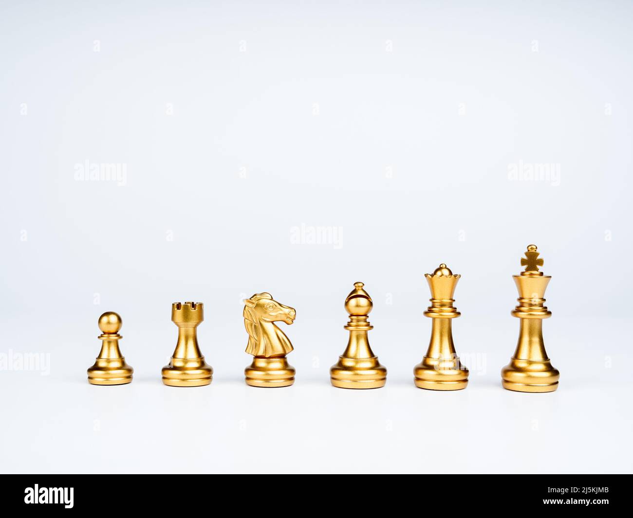 Premium Photo  The silver horse, knight chess piece standing with falling  golden queen, rook, bishop, pawn pieces on chessboard on dark, vertical.  leadership, winner, competition, and business strategy concept.