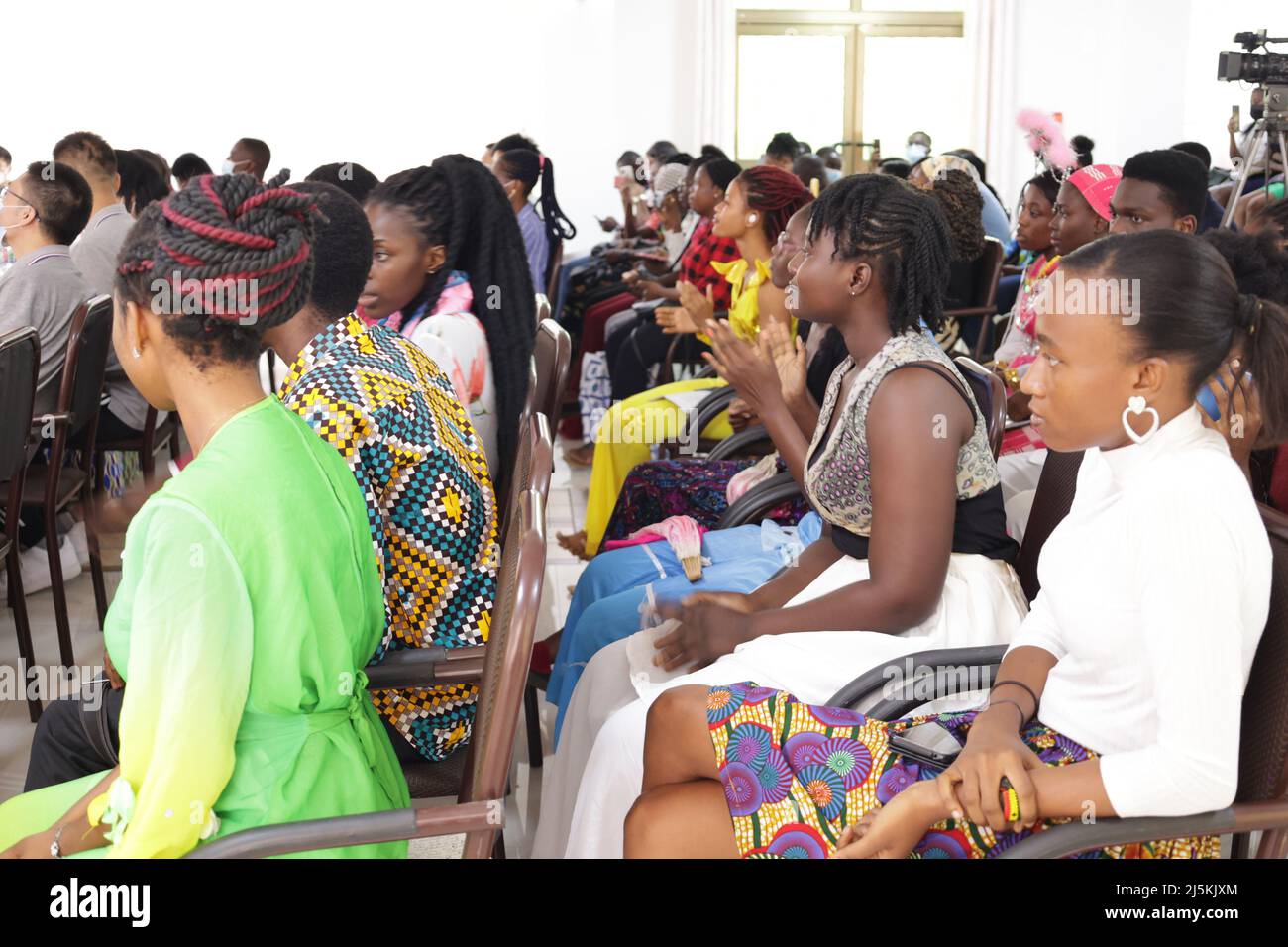 Accra, Ghana. 23rd Apr, 2022. Audiences watch a Chinese speech and