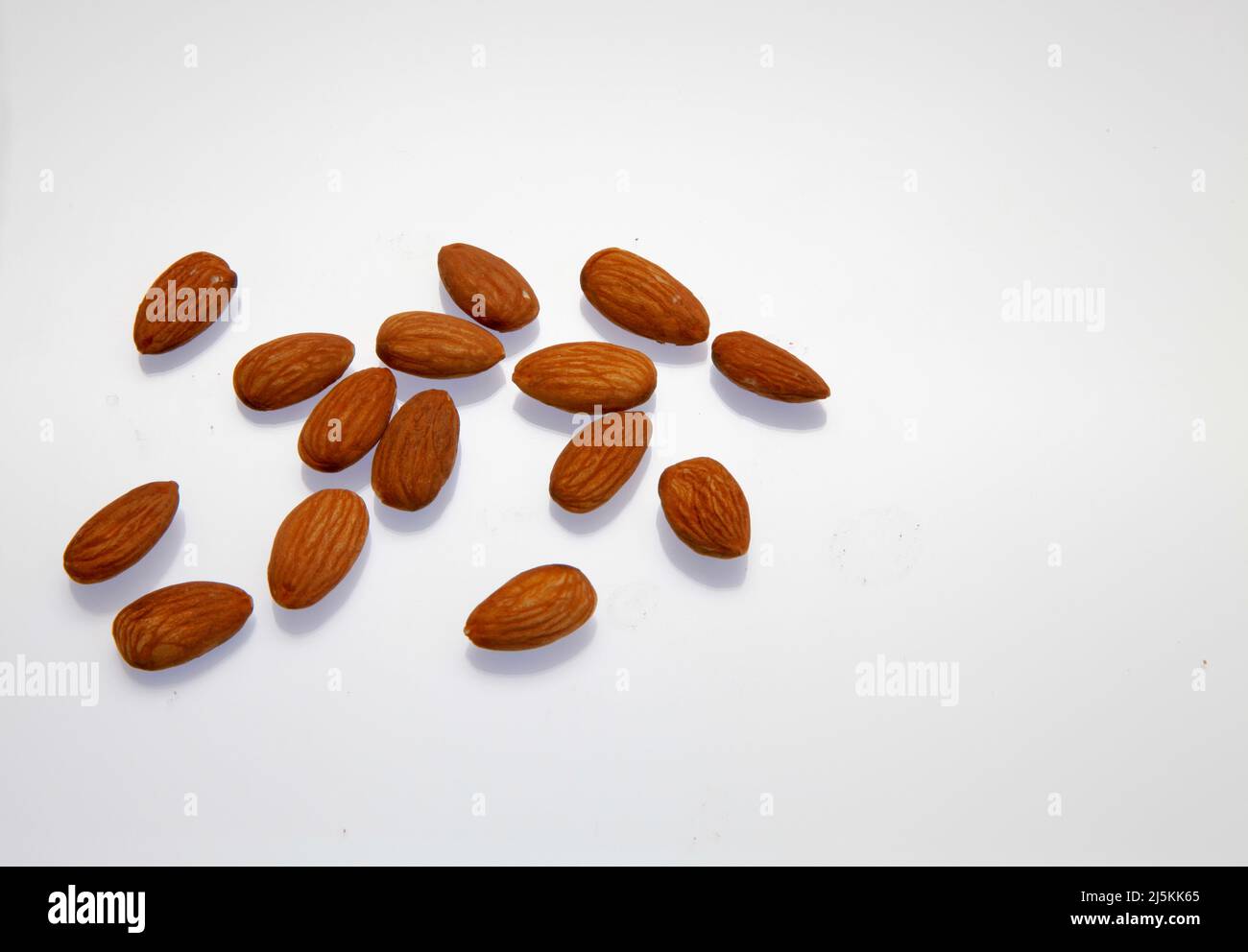 Almonds against a white background April 2022 Stock Photo