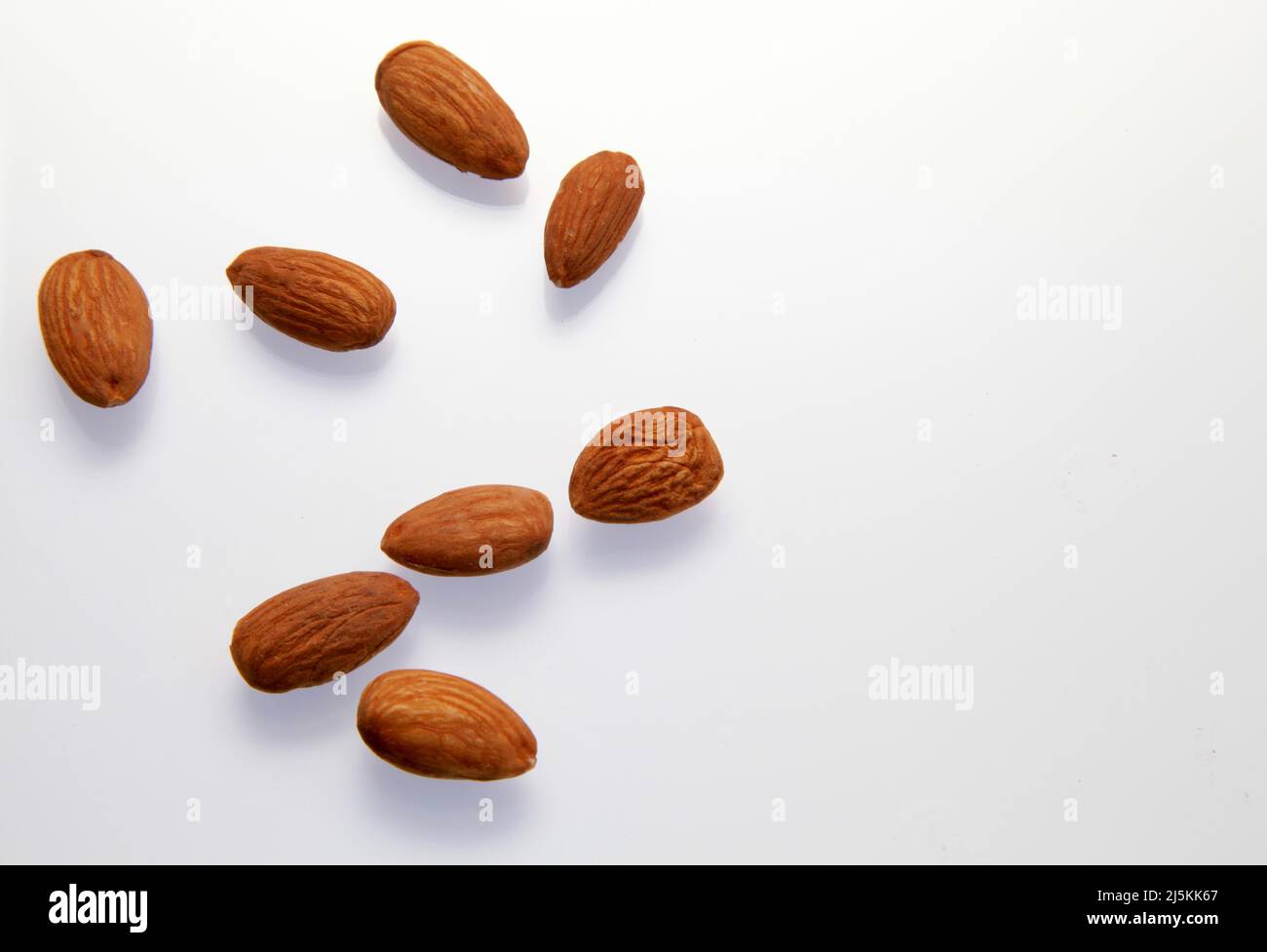 Almonds against a white background April 2022 Stock Photo