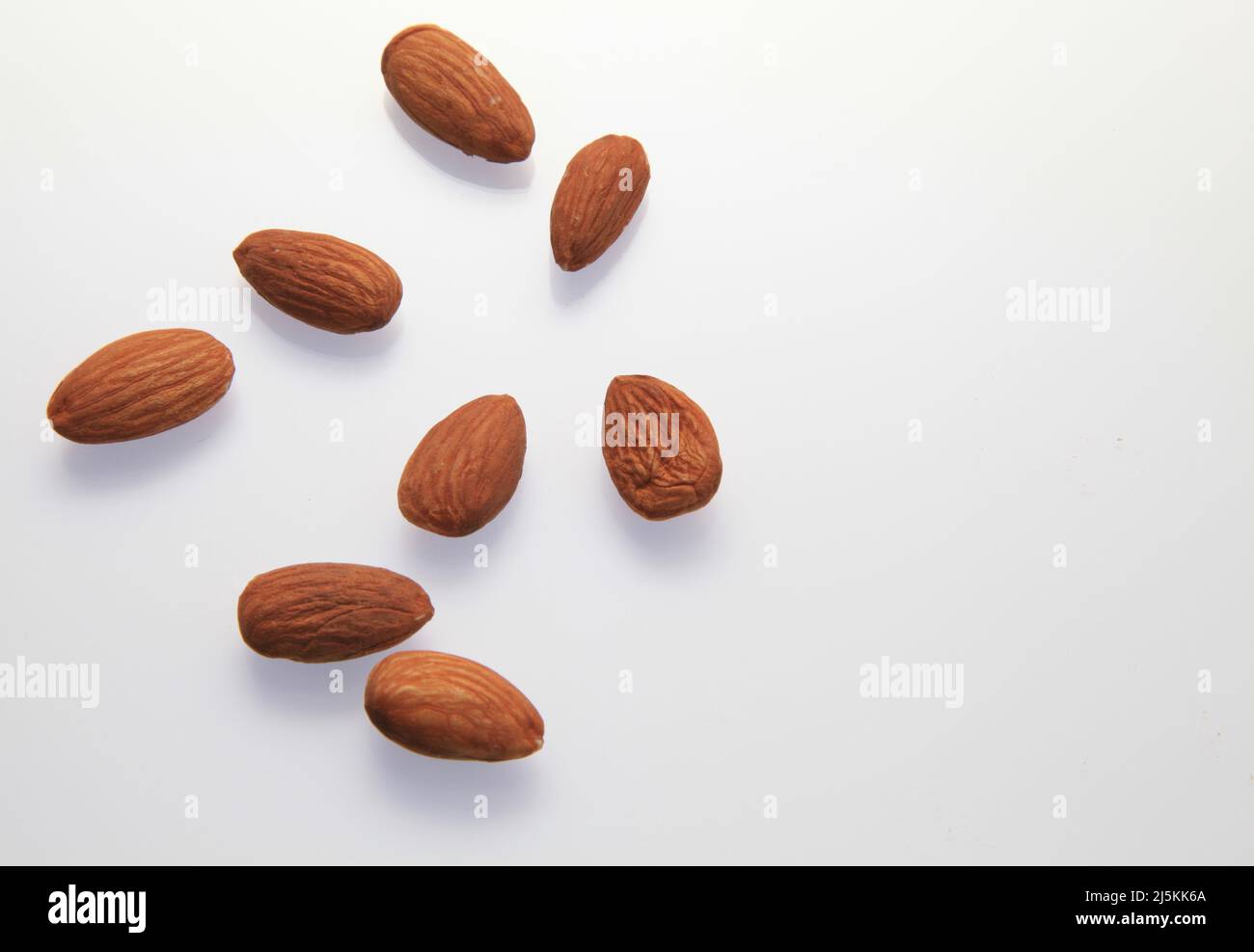 Almonds against a white background April 2022 Stock Photo