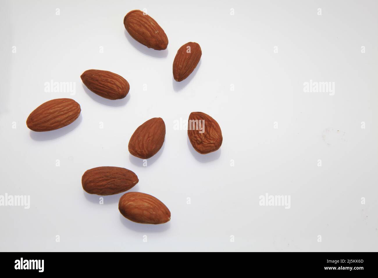 Almonds against a white background April 2022 Stock Photo