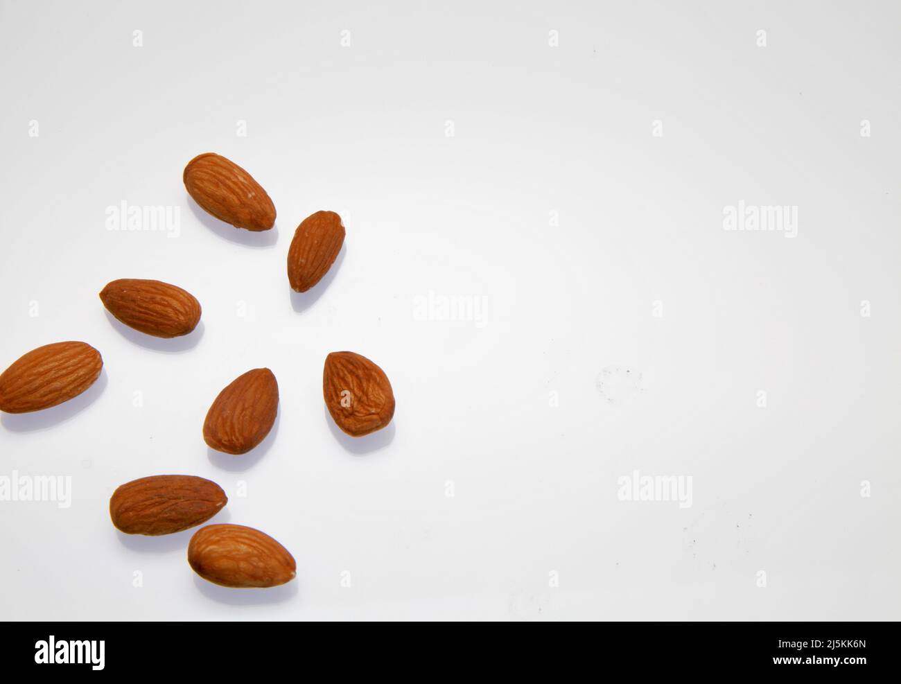Almonds against a white background April 2022 Stock Photo