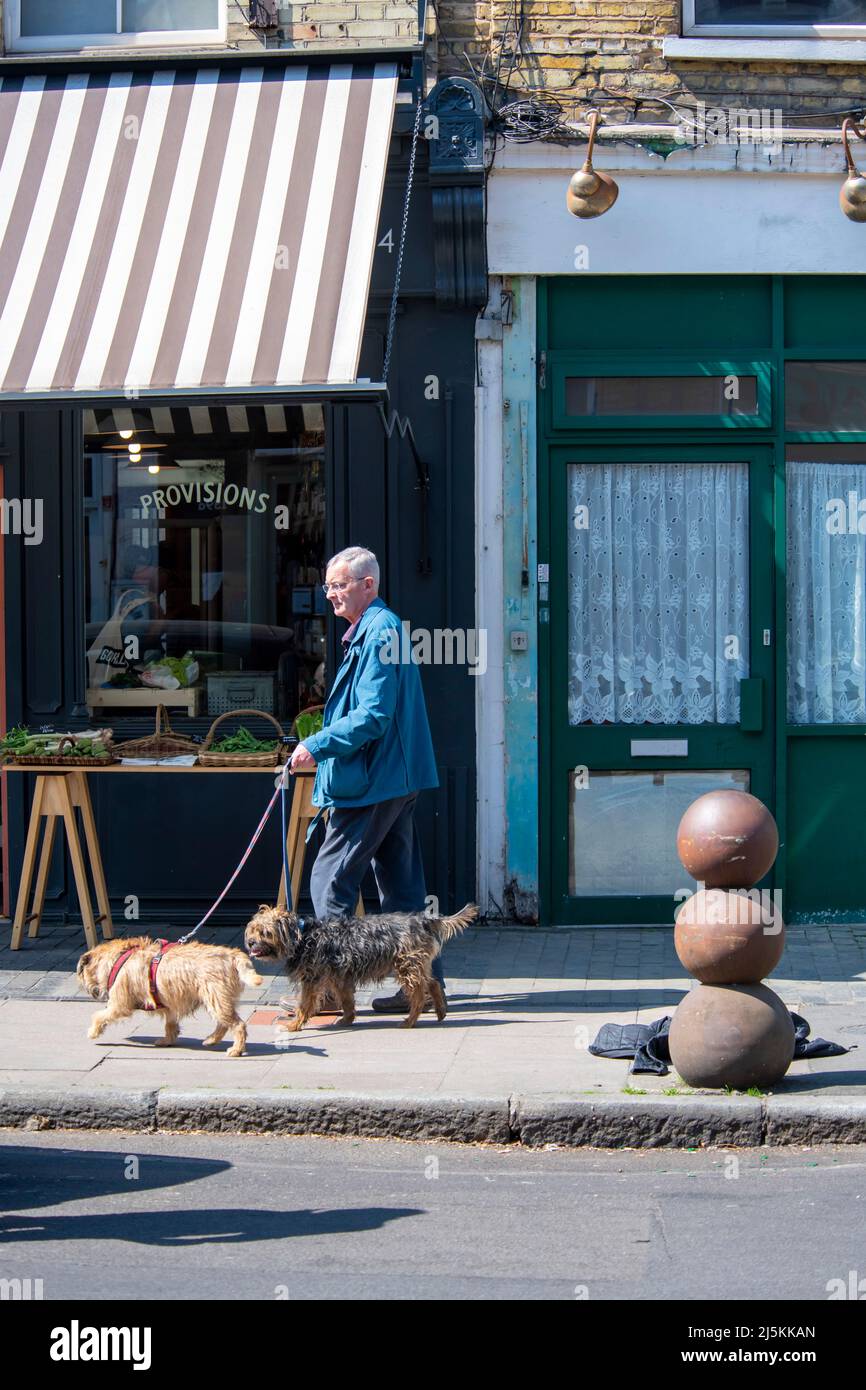 Dog walkers in Bellenden road Peckham London Stock Photo