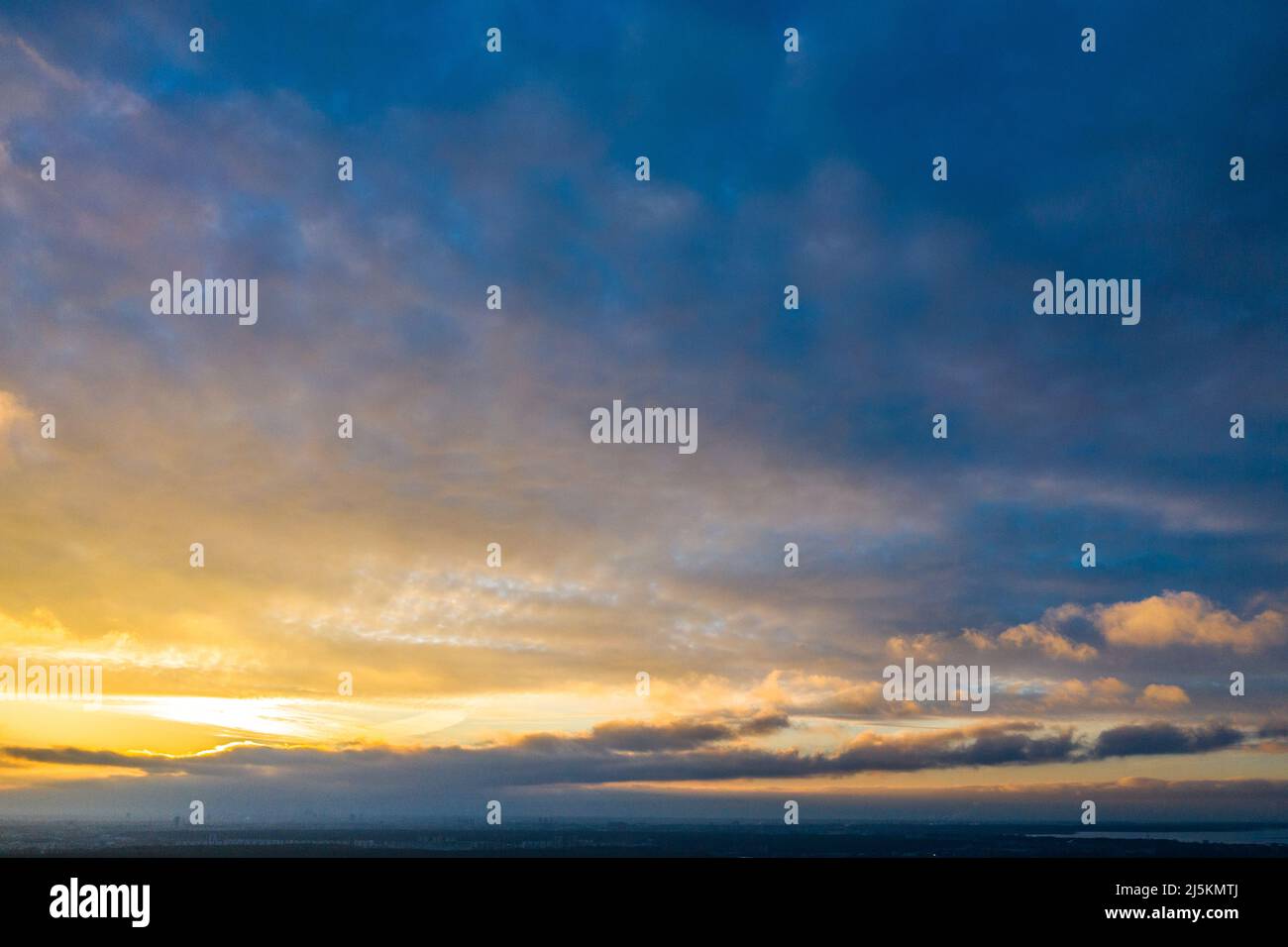 Scenic landscape of sunset sky with clouds above sea Stock Photo - Alamy